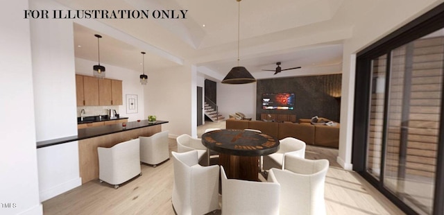 dining space featuring light hardwood / wood-style floors, sink, and ceiling fan