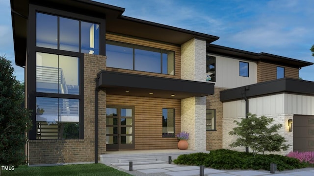 back of house featuring brick siding