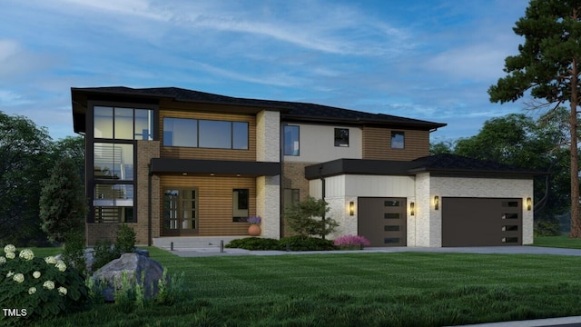 contemporary home with a front lawn and a garage