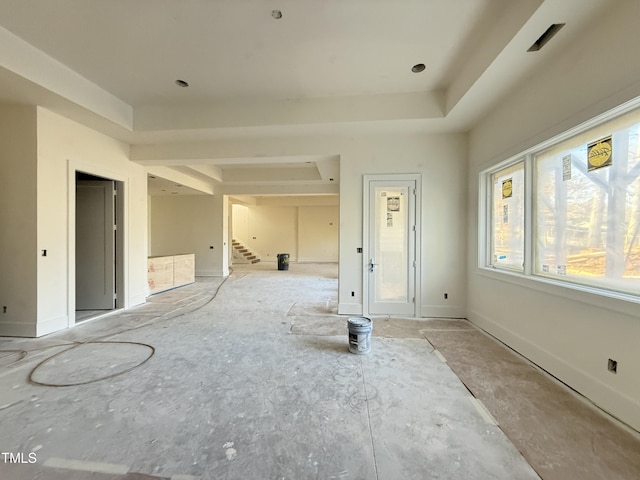 spare room featuring a tray ceiling