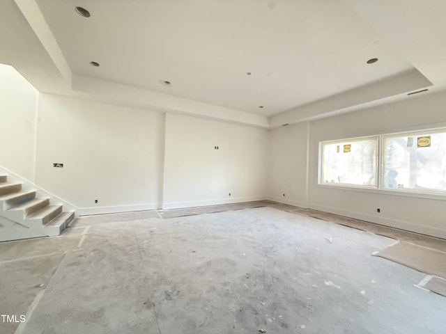 empty room with a tray ceiling