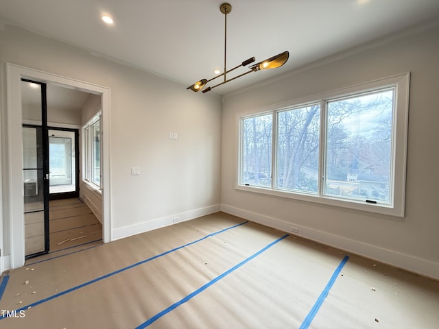 unfurnished dining area with baseboards, a chandelier, and recessed lighting