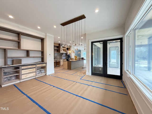 interior space featuring recessed lighting, french doors, a healthy amount of sunlight, and open shelves