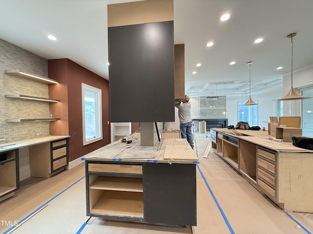 kitchen with open shelves, backsplash, light countertops, and recessed lighting