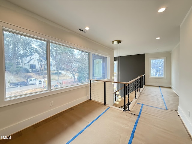 empty room with baseboards, visible vents, and recessed lighting