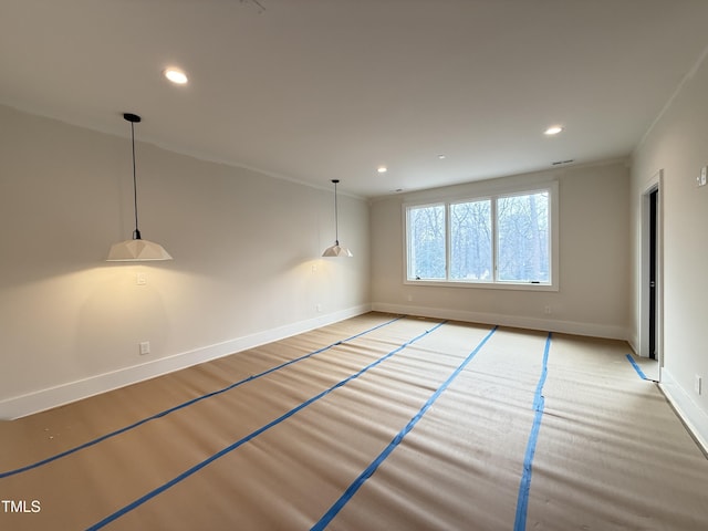 empty room with ornamental molding, recessed lighting, and baseboards