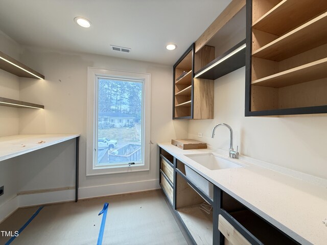 kitchen featuring recessed lighting, visible vents, a sink, and open shelves