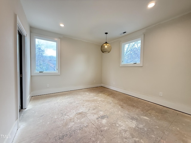 spare room with recessed lighting, visible vents, and baseboards