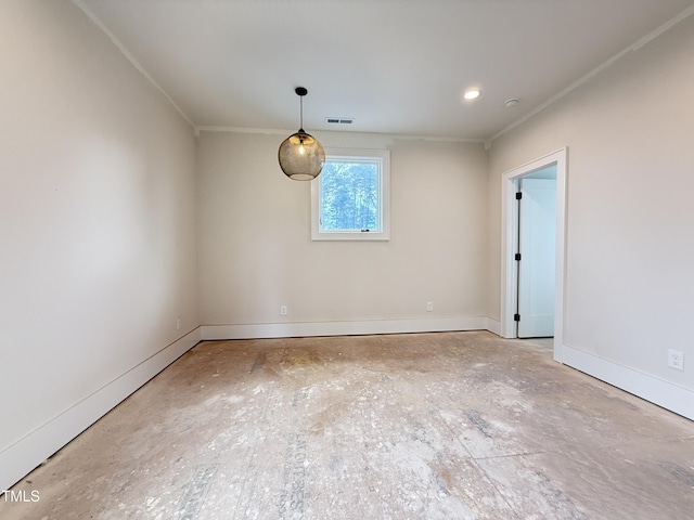 empty room with ornamental molding, visible vents, and baseboards