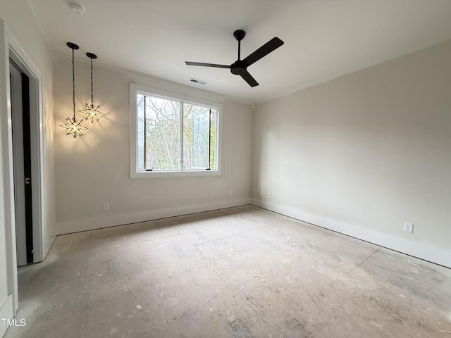 unfurnished room featuring a ceiling fan, visible vents, and baseboards