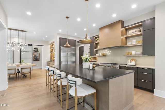 4123 Rockingham Dr, Raleigh, NC 27609 - kitchen featuring open shelves, stainless steel built in refrigerator, modern cabinets, a barn door, and light wood-style flooring