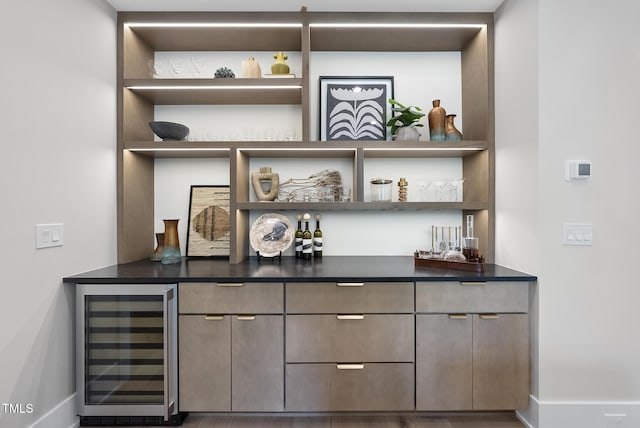 4123 Rockingham Dr, Raleigh, NC 27609 - indoor dry bar with wine cooler and baseboards