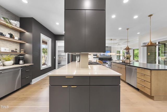 4123 Rockingham Dr, Raleigh, NC 27609 - kitchen with modern cabinets, appliances with stainless steel finishes, plenty of natural light, light wood-style flooring, and recessed lighting