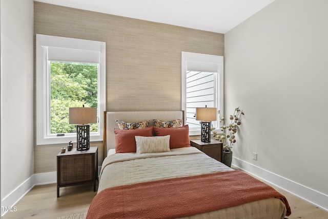 4123 Rockingham Dr, Raleigh, NC 27609 - bedroom featuring baseboards, wood finished floors, and wallpapered walls