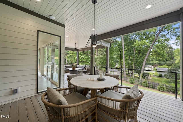 4123 Rockingham Dr, Raleigh, NC 27609 - wooden terrace with outdoor dining area and view of wooded area