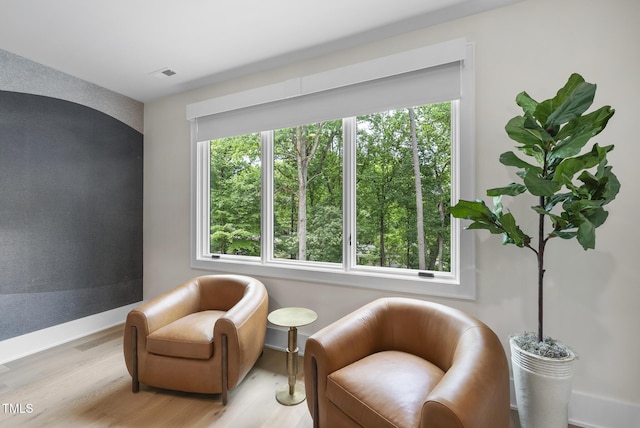 4123 Rockingham Dr, Raleigh, NC 27609 - sitting room with light wood-style floors and baseboards