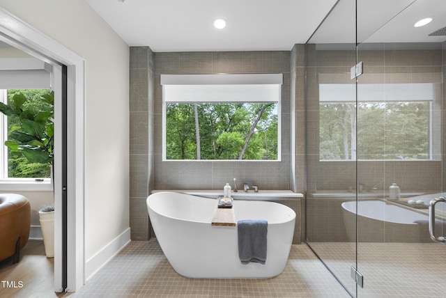 4123 Rockingham Dr, Raleigh, NC 27609 - bathroom with a freestanding bath, a stall shower, and tile patterned flooring