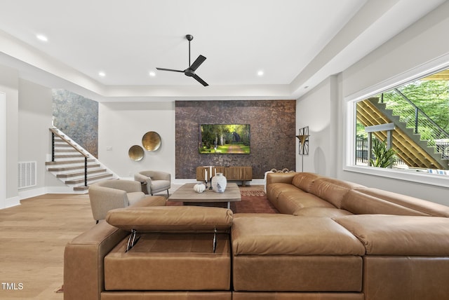 4123 Rockingham Dr, Raleigh, NC 27609 - living room featuring wood finished floors, ceiling fan, stairs, recessed lighting, and baseboards