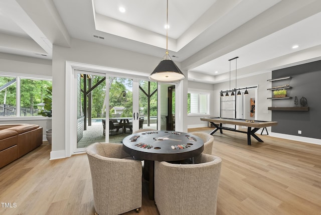 4123 Rockingham Dr, Raleigh, NC 27609 - dining room featuring a tray ceiling, baseboards, light wood finished floors, and recessed lighting