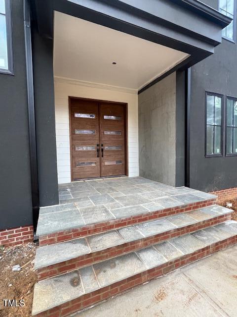 doorway to property featuring french doors