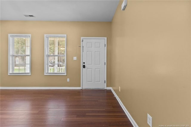 entryway with dark hardwood / wood-style floors