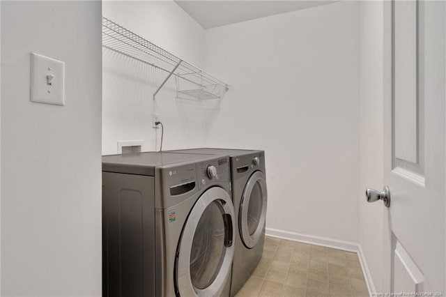 washroom with independent washer and dryer