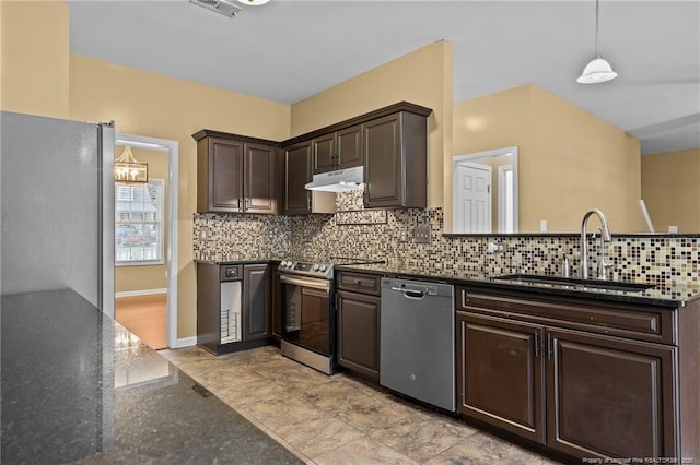 60 Hunters Way, Angier, NC 27501 - kitchen featuring dark brown cabinets, a sink, under cabinet range hood, appliances with stainless steel finishes, and decorative backsplash