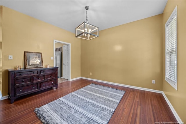 60 Hunters Way, Angier, NC 27501 - empty room with a chandelier, dark wood finished floors, and plenty of natural light
