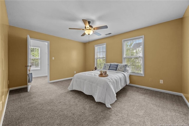 60 Hunters Way, Angier, NC 27501 - carpeted bedroom featuring baseboards and a ceiling fan