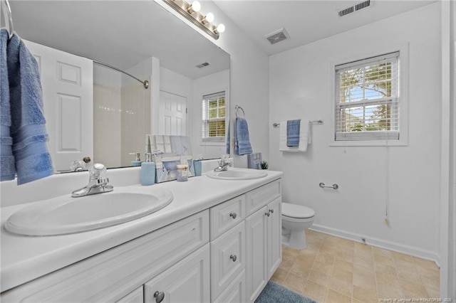 60 Hunters Way, Angier, NC 27501 - full bathroom with double vanity, a shower, and healthy amount of natural light