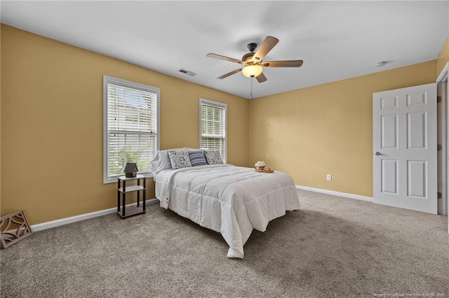 60 Hunters Way, Angier, NC 27501 - carpeted bedroom featuring baseboards and ceiling fan