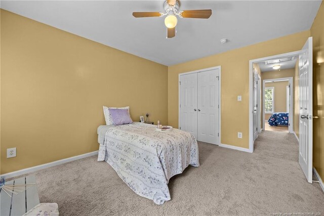 60 Hunters Way, Angier, NC 27501 - carpeted bedroom with a closet, attic access, and ceiling fan