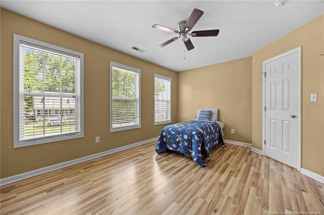 60 Hunters Way, Angier, NC 27501 - bedroom with light wood finished floors and ceiling fan