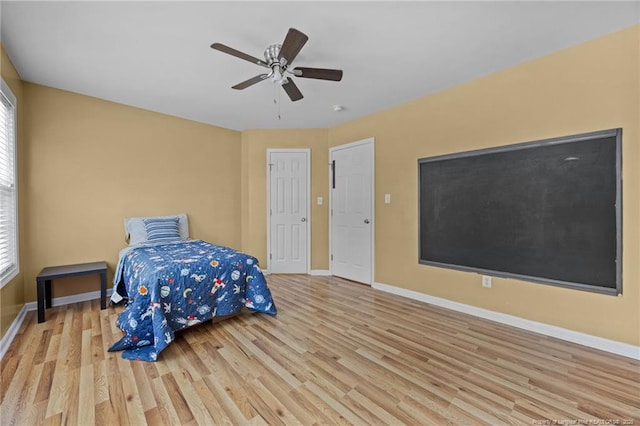 60 Hunters Way, Angier, NC 27501 - bedroom featuring wood finished floors, multiple windows, and a ceiling fan