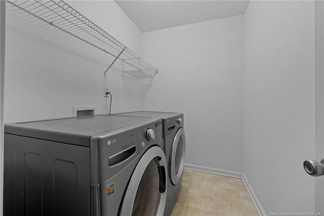 60 Hunters Way, Angier, NC 27501 - washroom with washing machine and clothes dryer and baseboards
