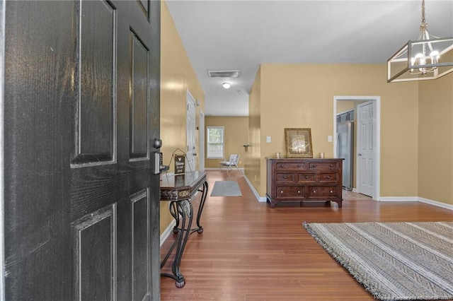 60 Hunters Way, Angier, NC 27501 - entryway featuring a chandelier and wood finished floors