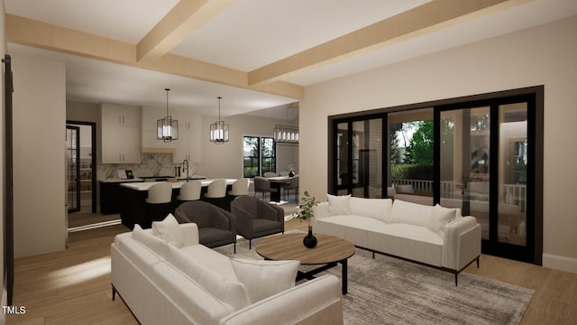 living room with beamed ceiling, sink, and light hardwood / wood-style floors