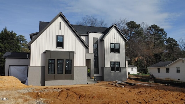 modern farmhouse featuring a garage