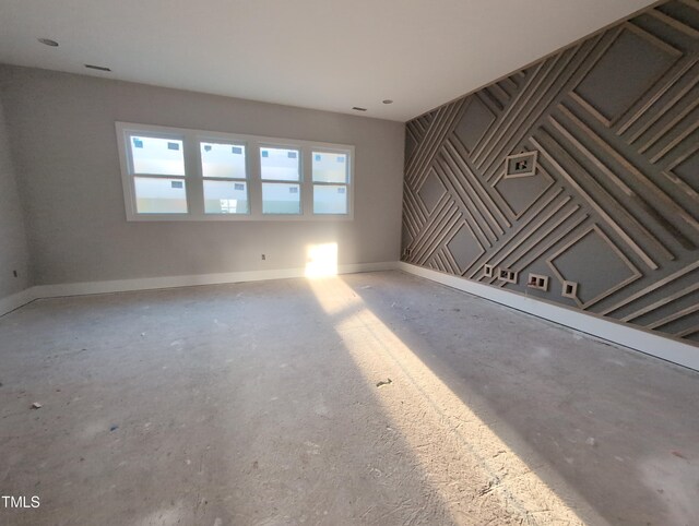 empty room featuring baseboards