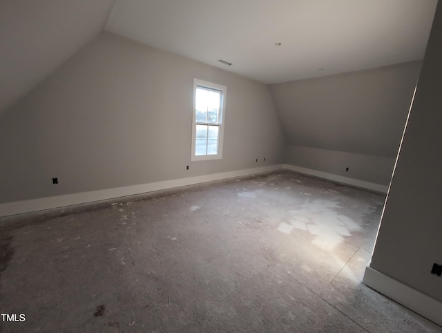 bonus room featuring baseboards, lofted ceiling, and visible vents