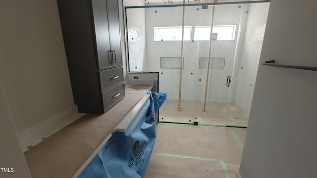 full bathroom with a shower stall