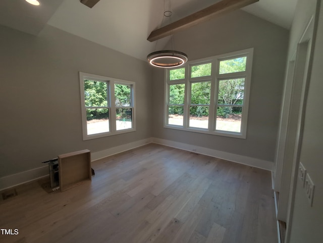 unfurnished room featuring vaulted ceiling with beams, visible vents, baseboards, recessed lighting, and wood finished floors
