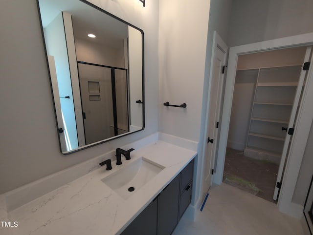 bathroom with vanity and a stall shower