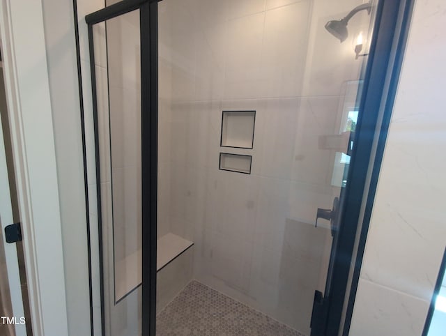 bathroom with a shower stall