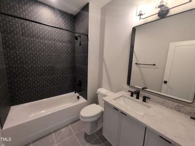 full bathroom featuring toilet, vanity, tile patterned floors, and shower / bath combination