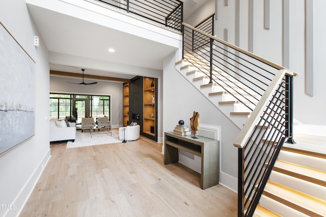 5812 Shawood Dr, Raleigh, NC 27609 - staircase with wood finished floors, a ceiling fan, baseboards, and recessed lighting