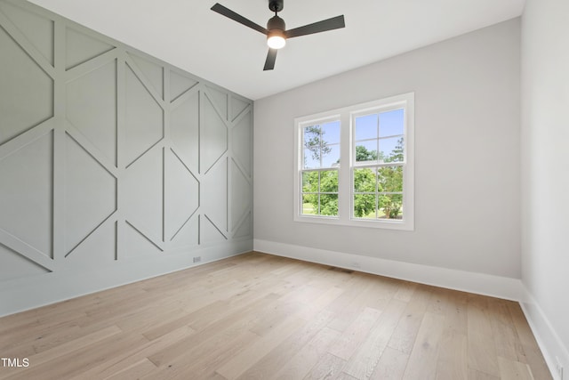 5812 Shawood Dr, Raleigh, NC 27609 - spare room featuring baseboards, light wood-style floors, and a ceiling fan