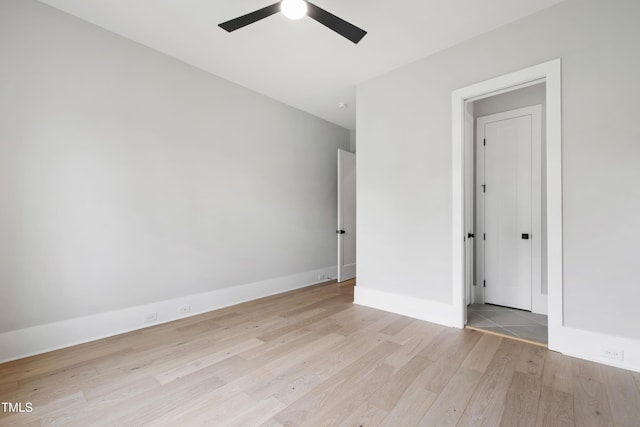 5812 Shawood Dr, Raleigh, NC 27609 - unfurnished bedroom with wood finished floors, baseboards, and a ceiling fan