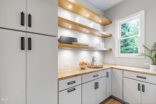 5812 Shawood Dr, Raleigh, NC 27609 - kitchen featuring open shelves, butcher block countertops, recessed lighting, white cabinetry, and light wood finished floors