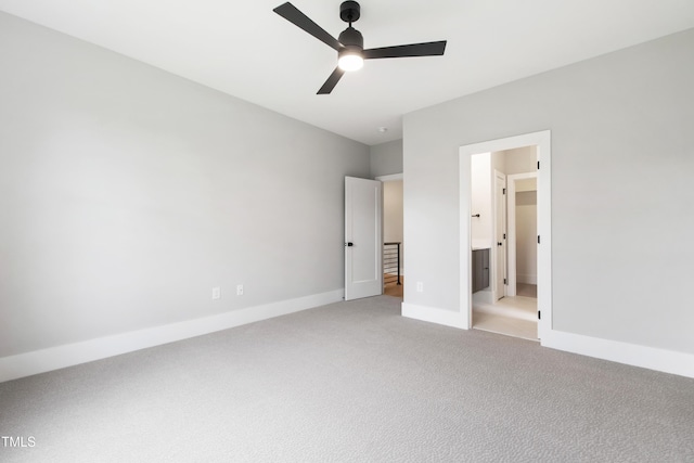 5812 Shawood Dr, Raleigh, NC 27609 - unfurnished bedroom featuring light carpet, baseboards, and ceiling fan